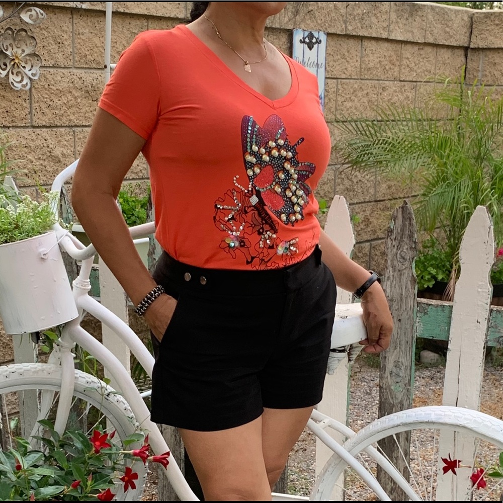 Orange 🍊 top with rhinestones and pearls